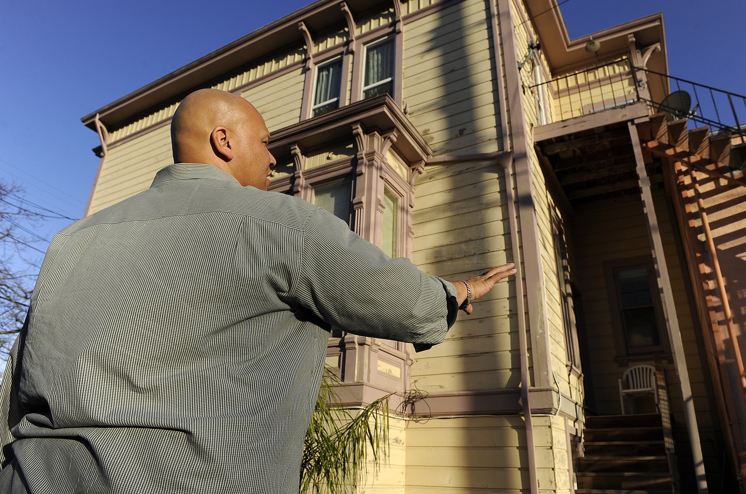 image of a man standing in front of a building